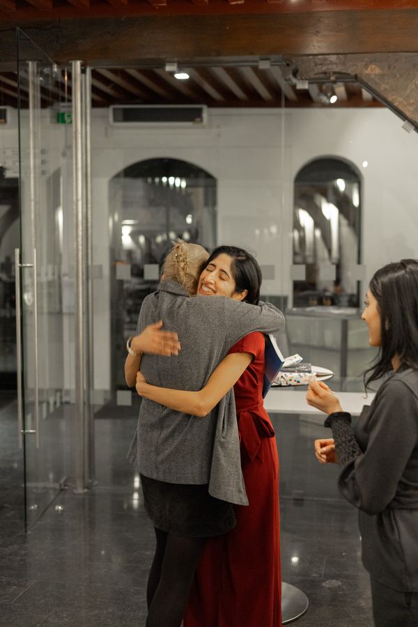 A long embrace in the foyer after a thesis defense